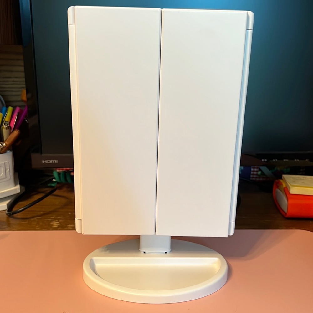 Tri-folded table makeup mirror.